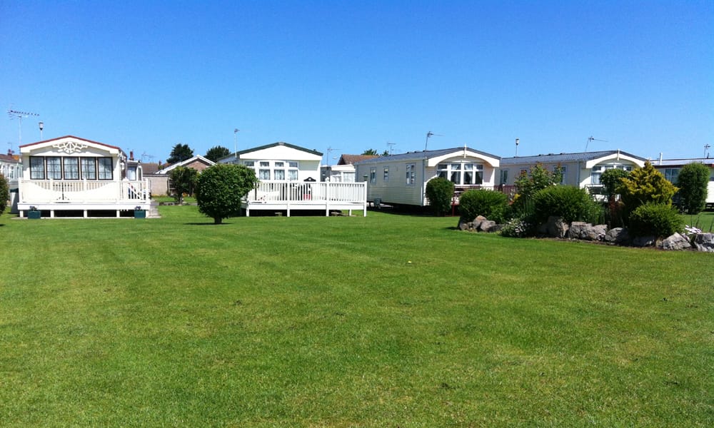 Row of caravans across a field at Pentre Mawr Caravan Park