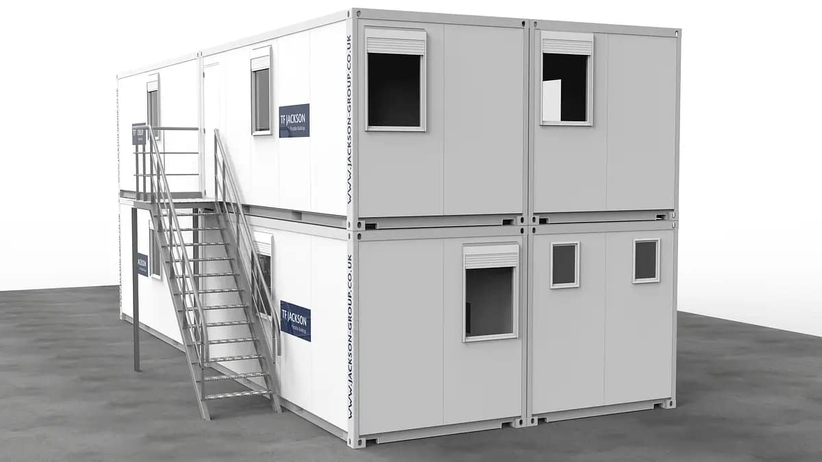 Stacked portable modular offices with external stairs, branded with the T.F. Jackson logo.
