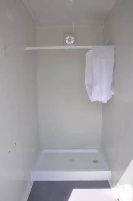 Interior view of a shower area in a modular building