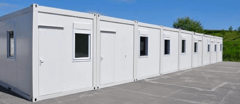 Line of new modular buildings ready for use in an open space