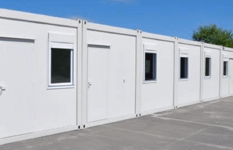 Line of new modular buildings ready for use in an open space