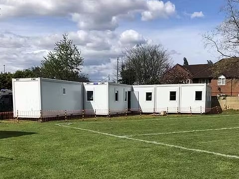 Portable educational facility set up on a school sports field
