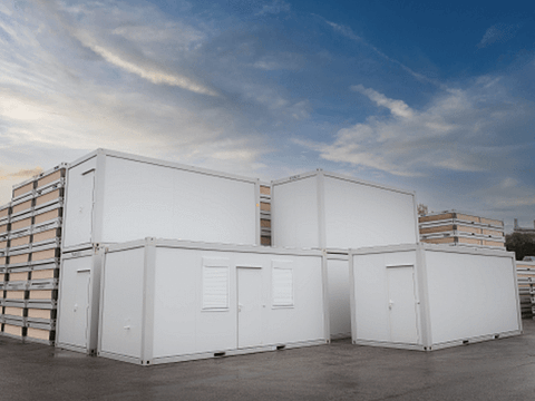 Stacked portable storage containers in a holding facility