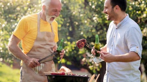 Men grilling meat on a barbecue Barbecue rental is now available at Bron-Y-Wendon caravan park
