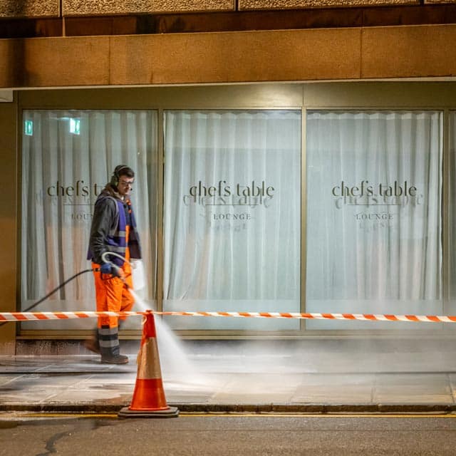 pressure wash cleaning pavement