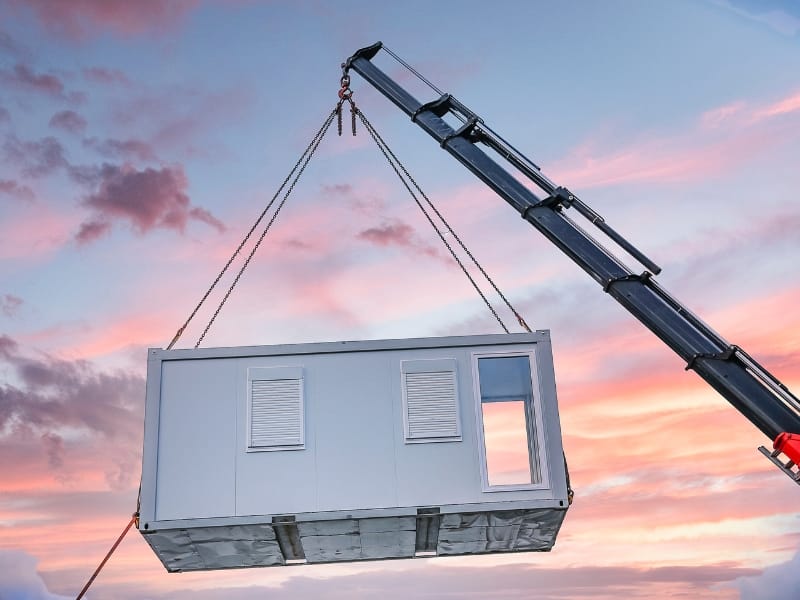 A TF Jackson unit being craned in to place as the sun sets
