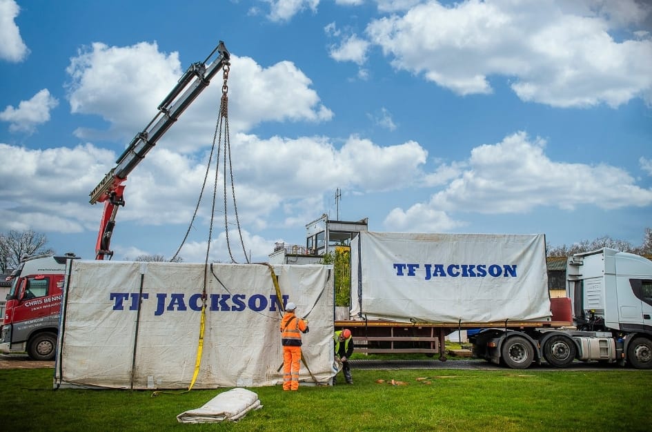 TF Jackson unloading the units by crane that will comprise Fairoaks Airport's new terminal building