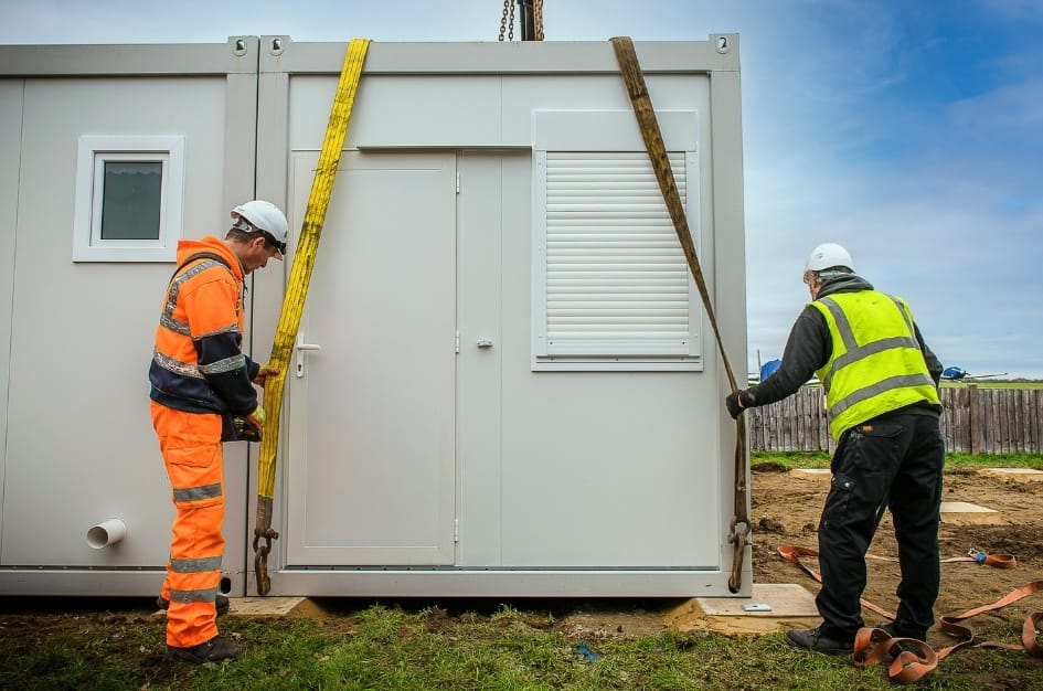 Un-hooking the lift system attached to Fairoaks Airport's new building