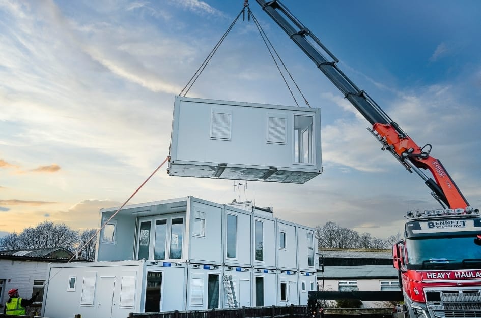 The final modular building shell being craned into place at Fairoaks Airport terminal