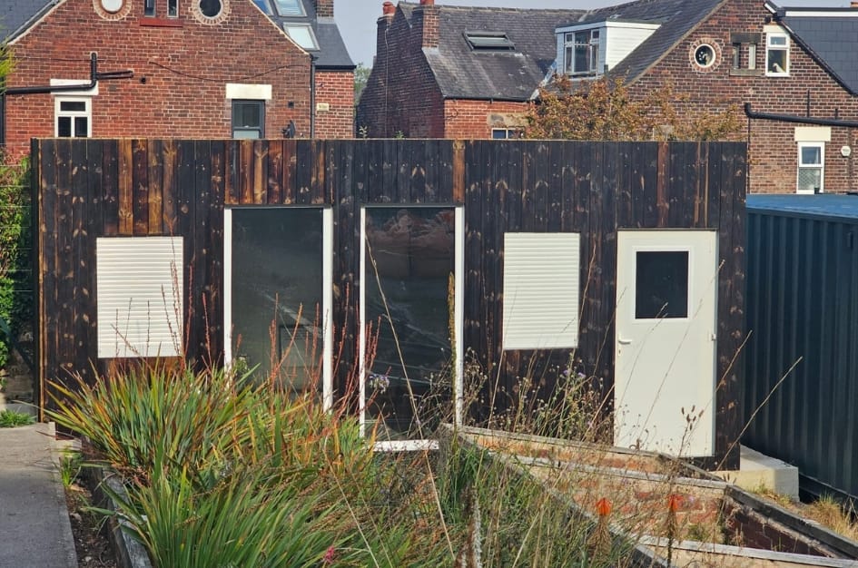 Allotment building using a TF Jackson modular unit, finished in dark timber cladding