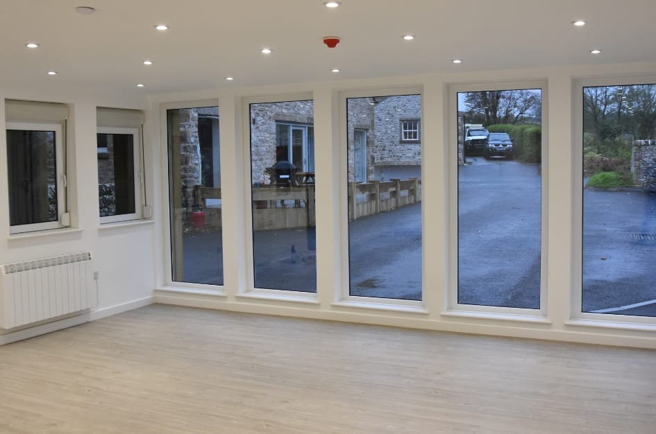 Interior shot of Farditch Farm Café, showing the full length glass frontage